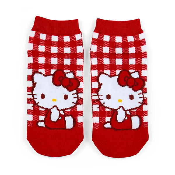 Red and white checkered socks with Hello Kitty design on a white background