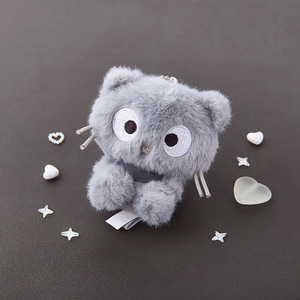 Sanrio Chococat Monochrome Plush Mascot Keychain Charm featuring a soft grey-toned design on a flat surface.