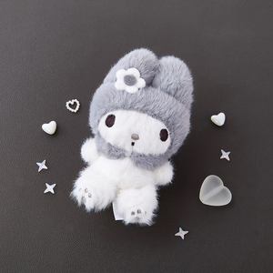 Sanrio My Melody Monochrome Plush Mascot Keychain Charm on a dark surface, surrounded by decorative hearts and stars.