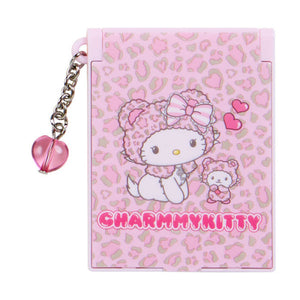 Pink notebook with leopard print and cartoon character, featuring 'Charmmy Kitty' on a white background.