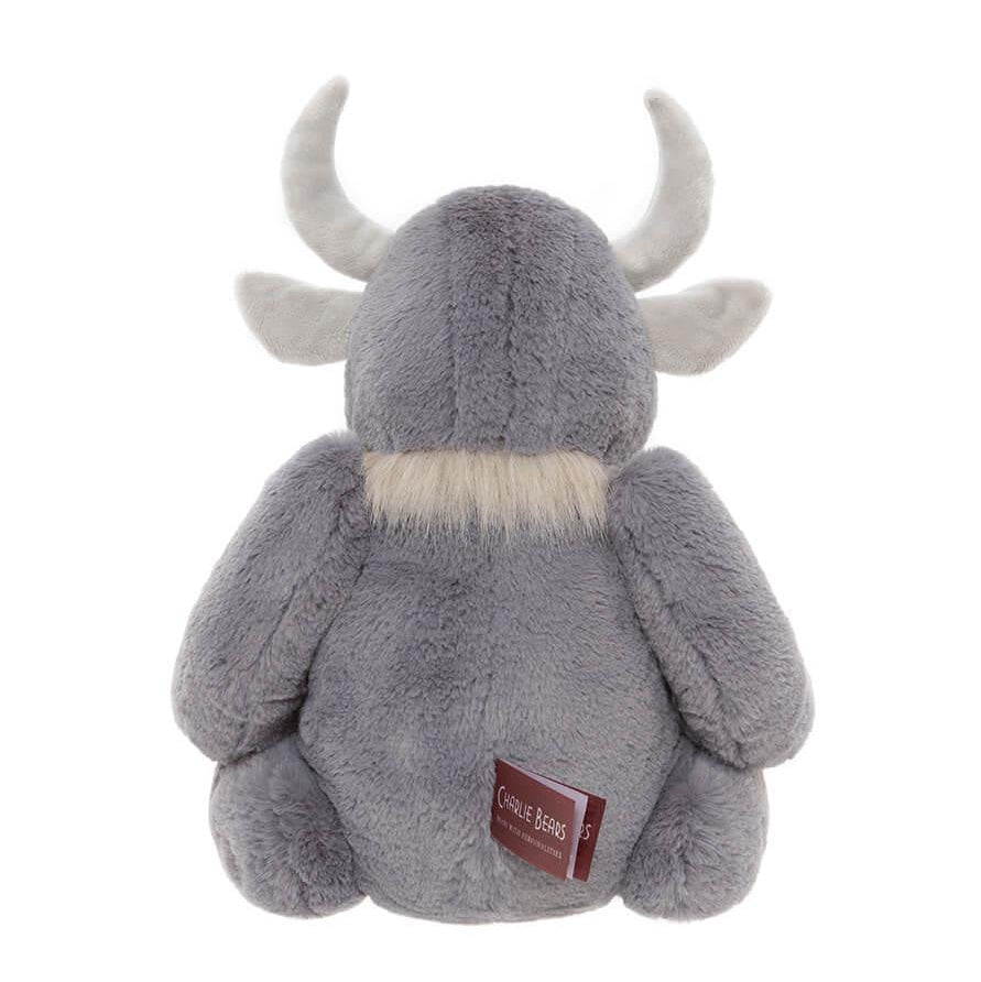 Plush toy moose with a visible brand label on a white background
