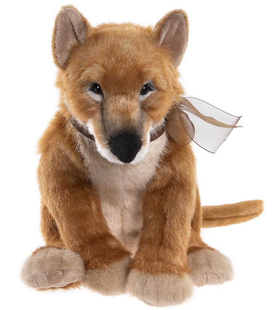 Plush toy fox with a bow on a white background