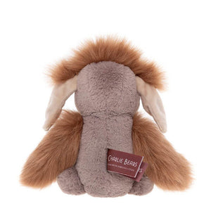 Plush toy resembling a lion with a visible brand tag on a white background