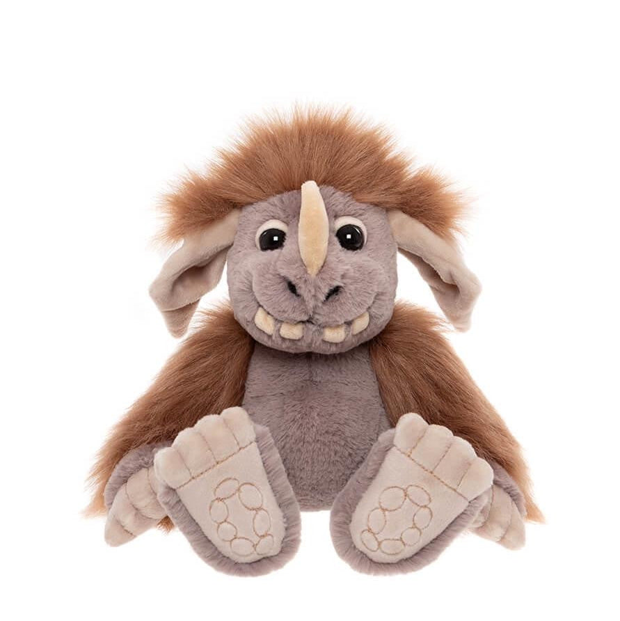 Plush toy resembling a woolly mammoth on a white background