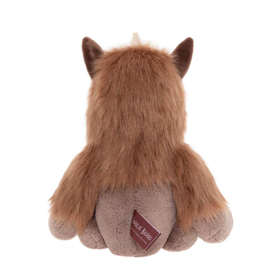 Brown plush toy with a visible brand label on a white background