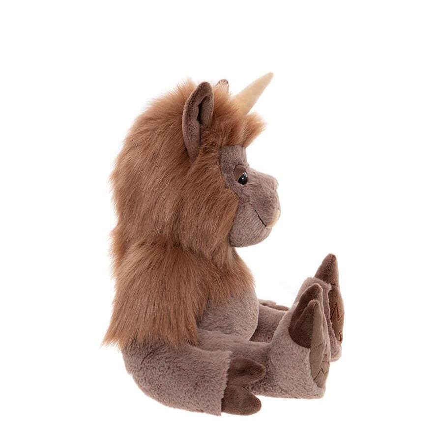 Plush toy unicorn with brown fur and a white horn on a white background