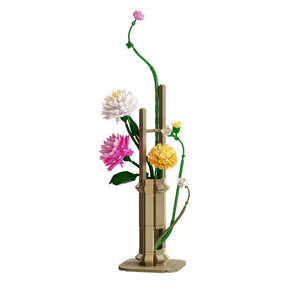 Decorative bamboo vase with flowers on a white background