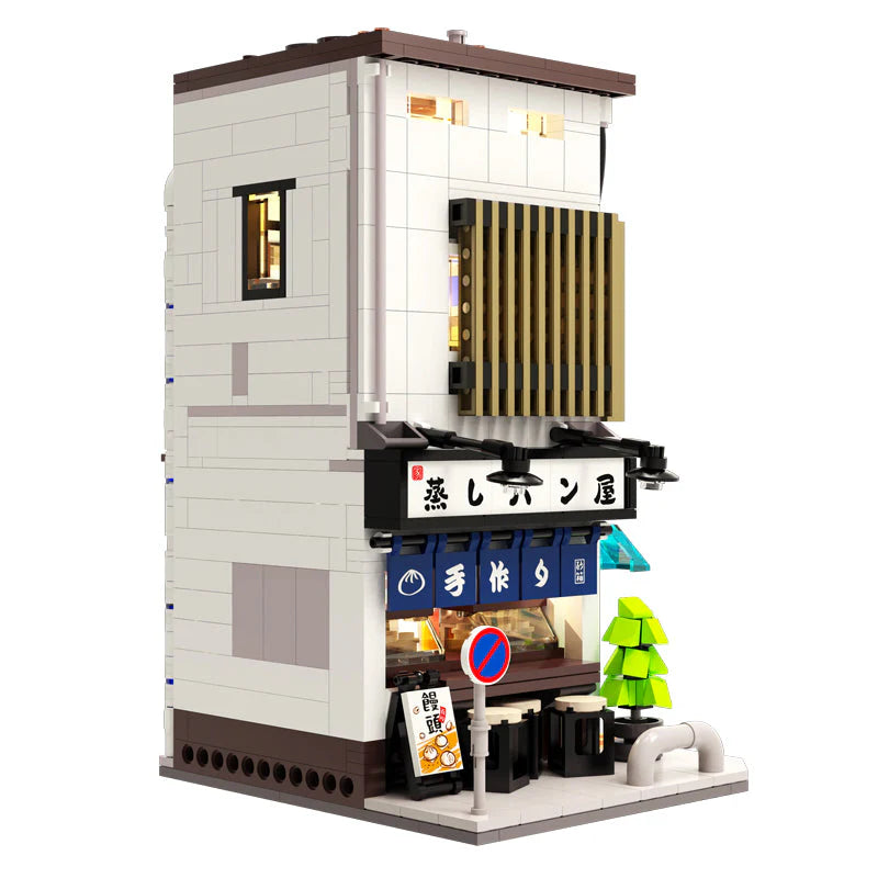 Model of a Japanese restaurant building made from interlocking bricks on a white background