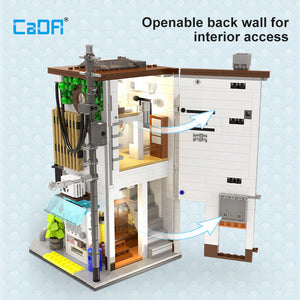 Model of a building with an openable back wall, featuring CADa branding.