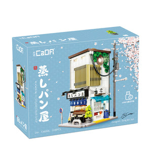 Model building kit packaging with a bakery design on a blue background