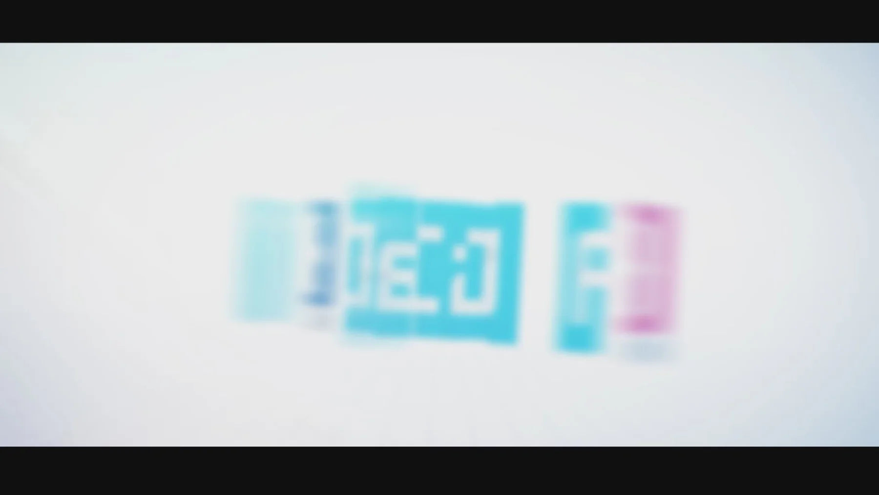 Blurred text with colorful boxes on a light background
