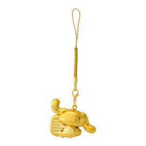 Gold elephant-shaped keychain on a white background