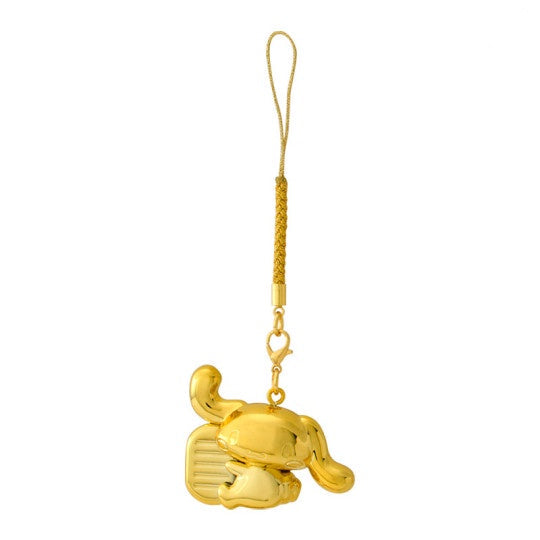 Gold elephant-shaped keychain on a white background