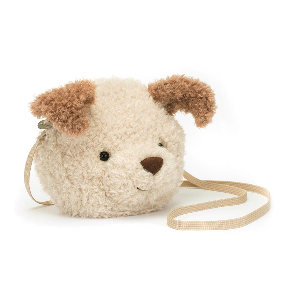 Dog-shaped crossbody bag with a soft texture on a white background