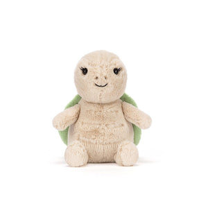 Plush turtle toy with a green shell on a white background