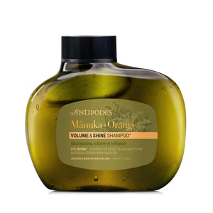 Antipodes Manuka + Orange Volume & Shine Shampoo bottle on a white background