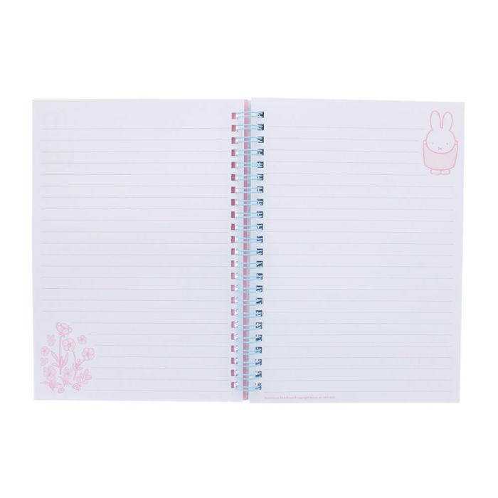 Notebook with pink floral design on white background
