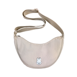 Beige crossbody bag with a small logo on a white background