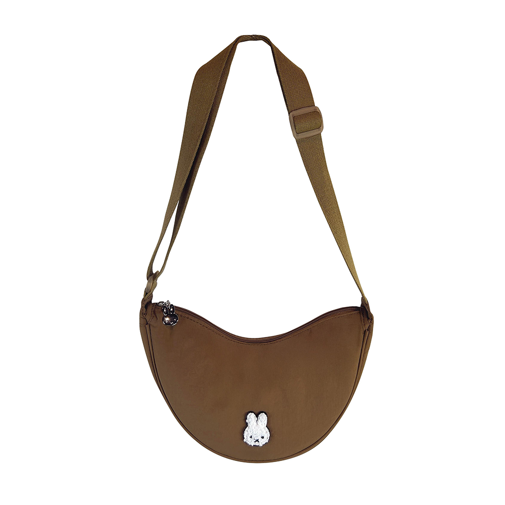 Brown shoulder bag with a small white rabbit emblem on a white background