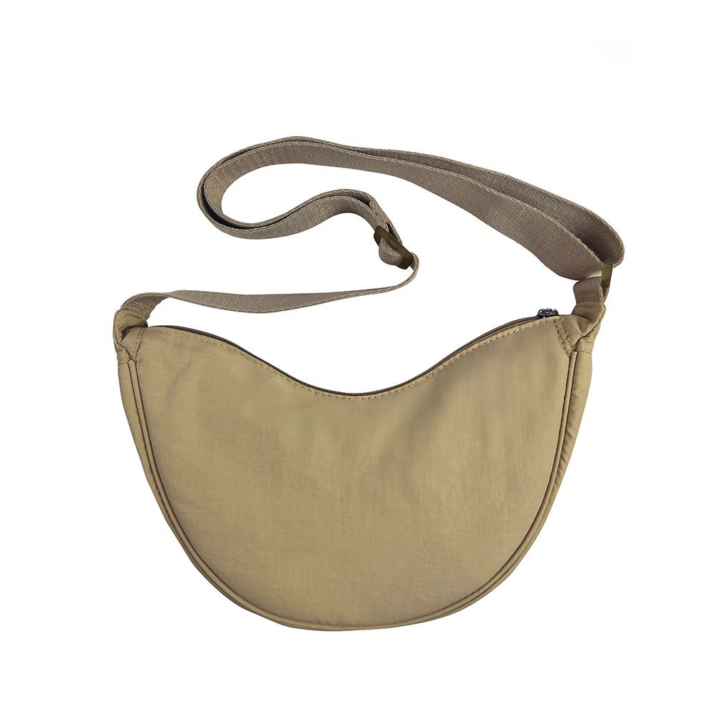 Beige crossbody bag with a strap on a white background