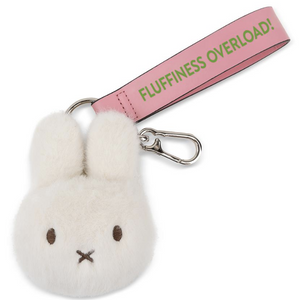 Plush keychain with a pink strap labeled 'Fluffiness Overload!' on a white background