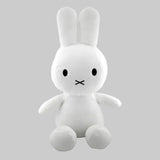 White plush rabbit toy with a simple face on a white background