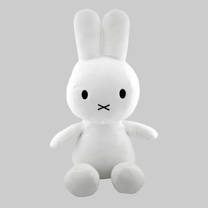 White plush rabbit toy with a simple face on a white background