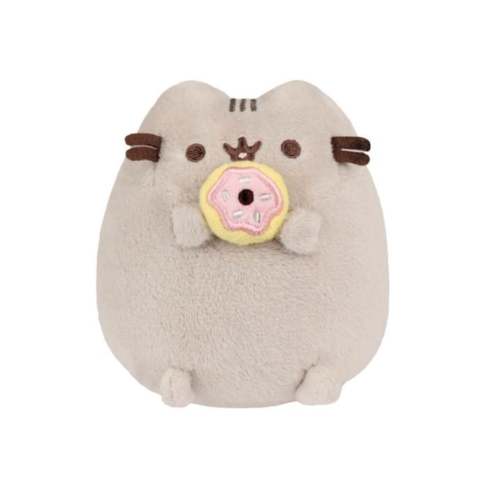 Plush toy resembling a cat holding a donut on a white background