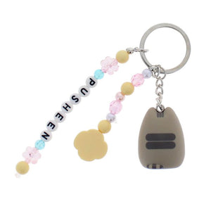 Keychain with colorful beads and a small animal-shaped charm on a white background