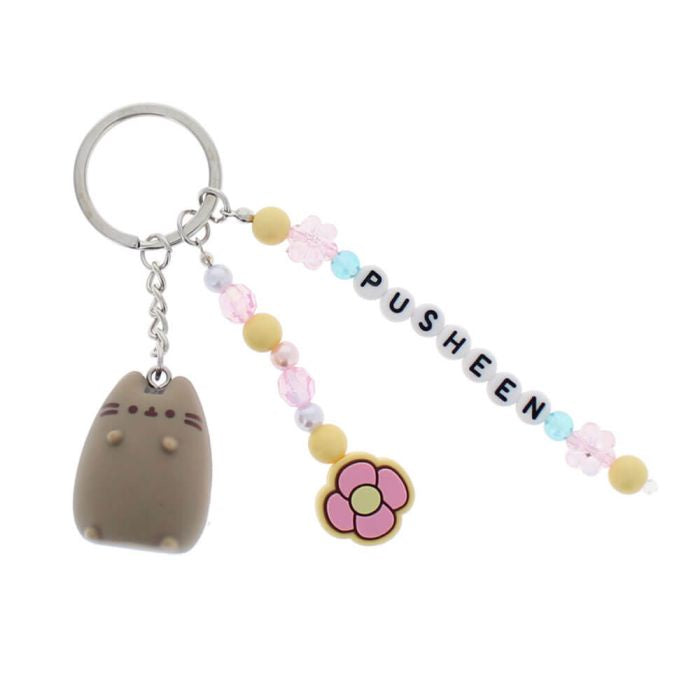 Keychain with Pusheen cat charm, flower, and 'Pusheen' text on a white background