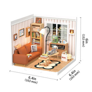 Miniature model of a living room with furniture and decor, including dimensions.