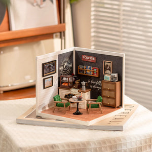 Miniature model of a coffee shop inside an open book