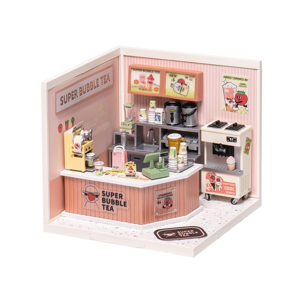 Model of a bubble tea shop with various appliances and decor on a white background