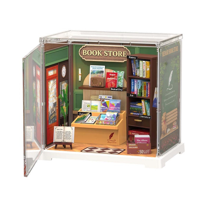 Model of a book store with books and a sign on a white background