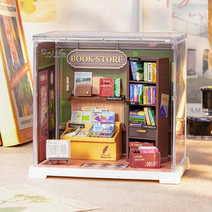 Miniature model of a book store with books and shelves inside a transparent box.