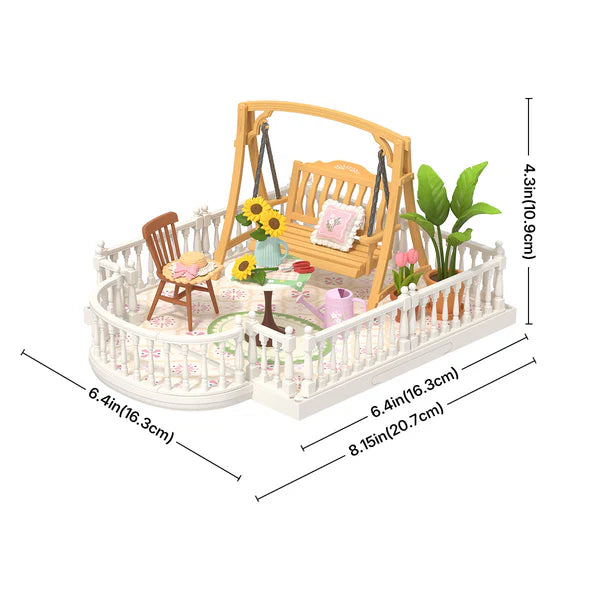 Miniature garden scene with a swing, table, chairs, and plants, including dimensions.