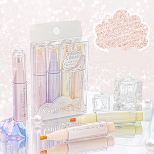 Set of colorful markers with packaging on a glittery background
