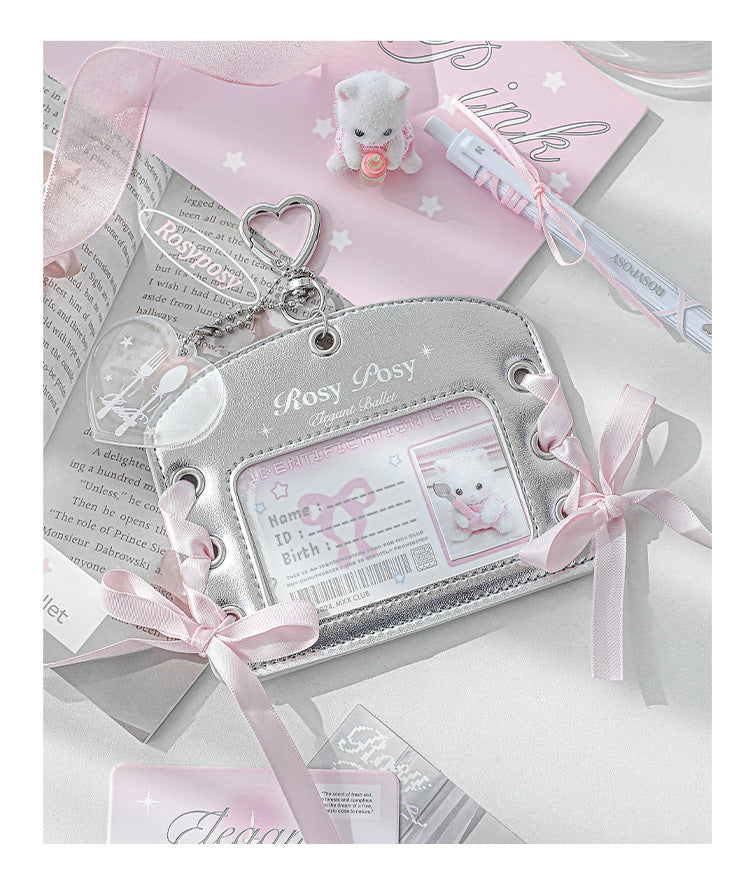 Silver baby card holder with pink ribbons and a teddy bear design on a white background