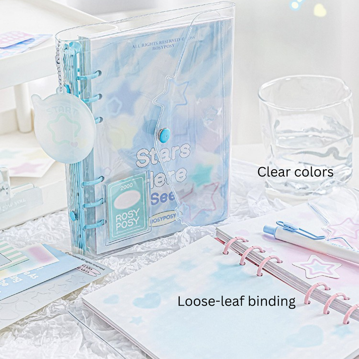 Clear planner with loose-leaf binding on a light surface