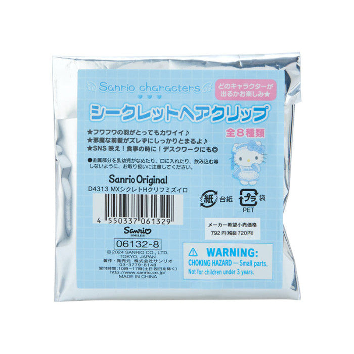 Packaged hair clip with blue label and Sanrio branding on a white background