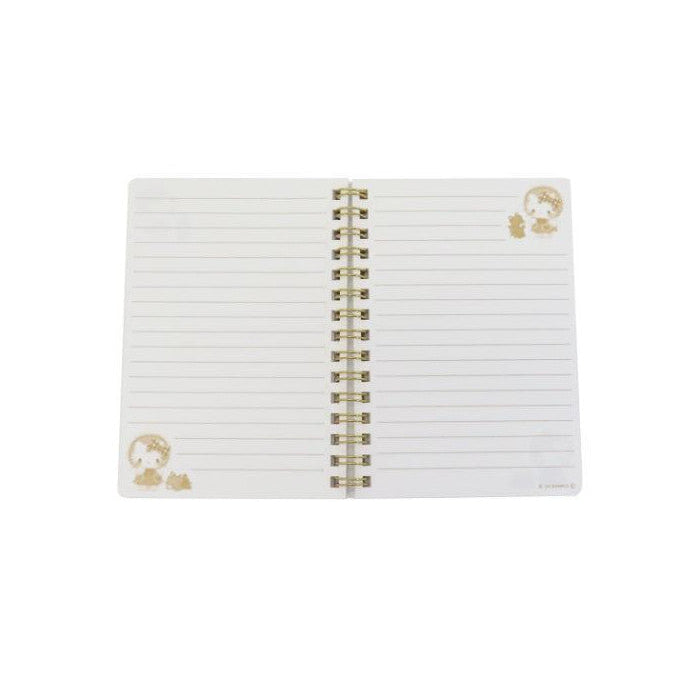White notebook with gold spiral binding and small gold emblem on a white background