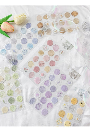 Collection of colorful round stickers on a white surface with tulip flowers.