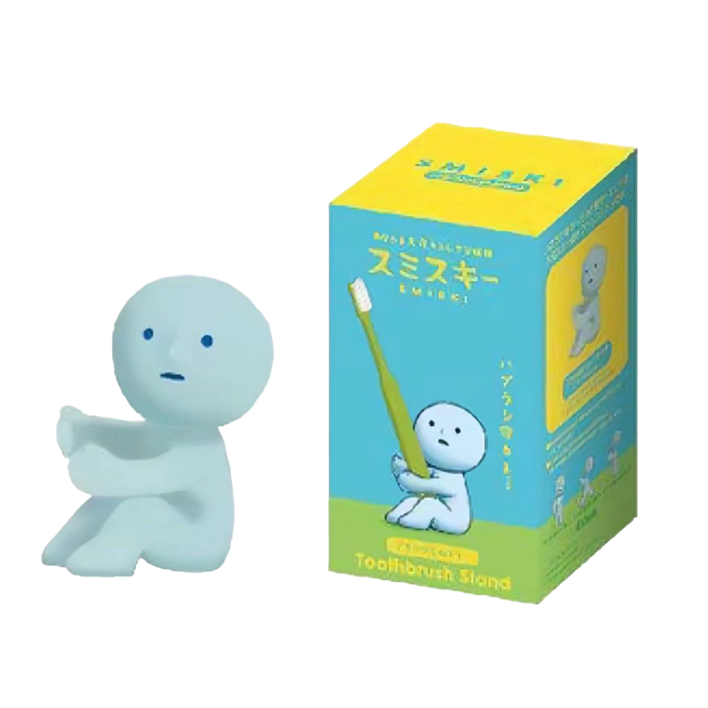 Blue cartoon character toothbrush stand with packaging on a white background