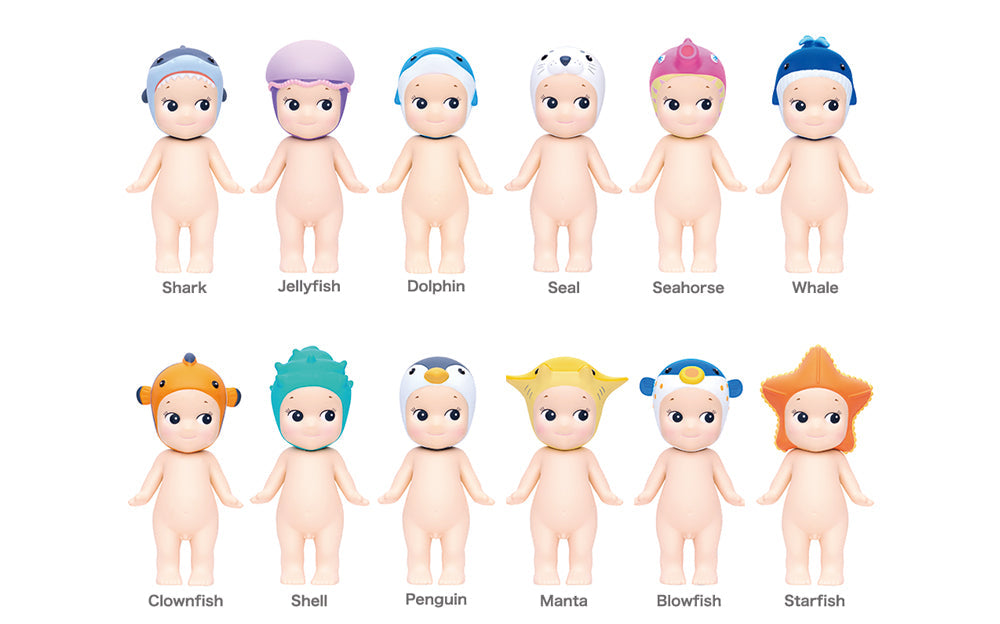 Set of 12 small figurines with colorful hats labeled from 'Shark' to 'Starfish'.