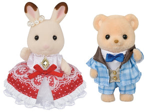 Two plush toys, a rabbit and a bear, dressed in formal attire on a white background.
