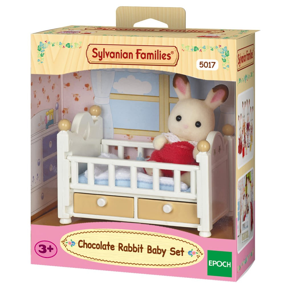 Sylvanian Families Chocolate Rabbit Baby Set packaging with a rabbit in a crib.