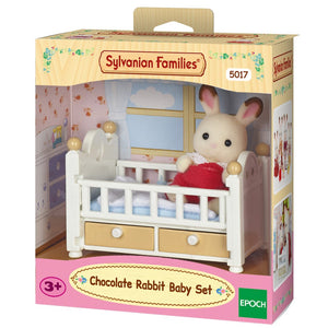 Sylvanian Families Chocolate Rabbit Baby Set packaging with a rabbit in a crib.