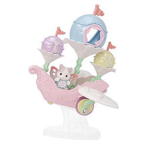 Pastel-colored toy set with a baby carriage and various accessories on a white background