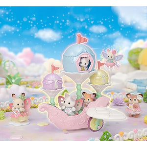 Toy set with a pink fairy carriage and small fairy figures against a colorful, fantasy-themed background.