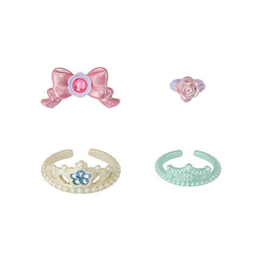 Set of four decorative hair accessories including a bow, flower, tiara, and butterfly on a white background.